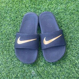 Nike Black Slide Sandals with Metallic Gold Logo